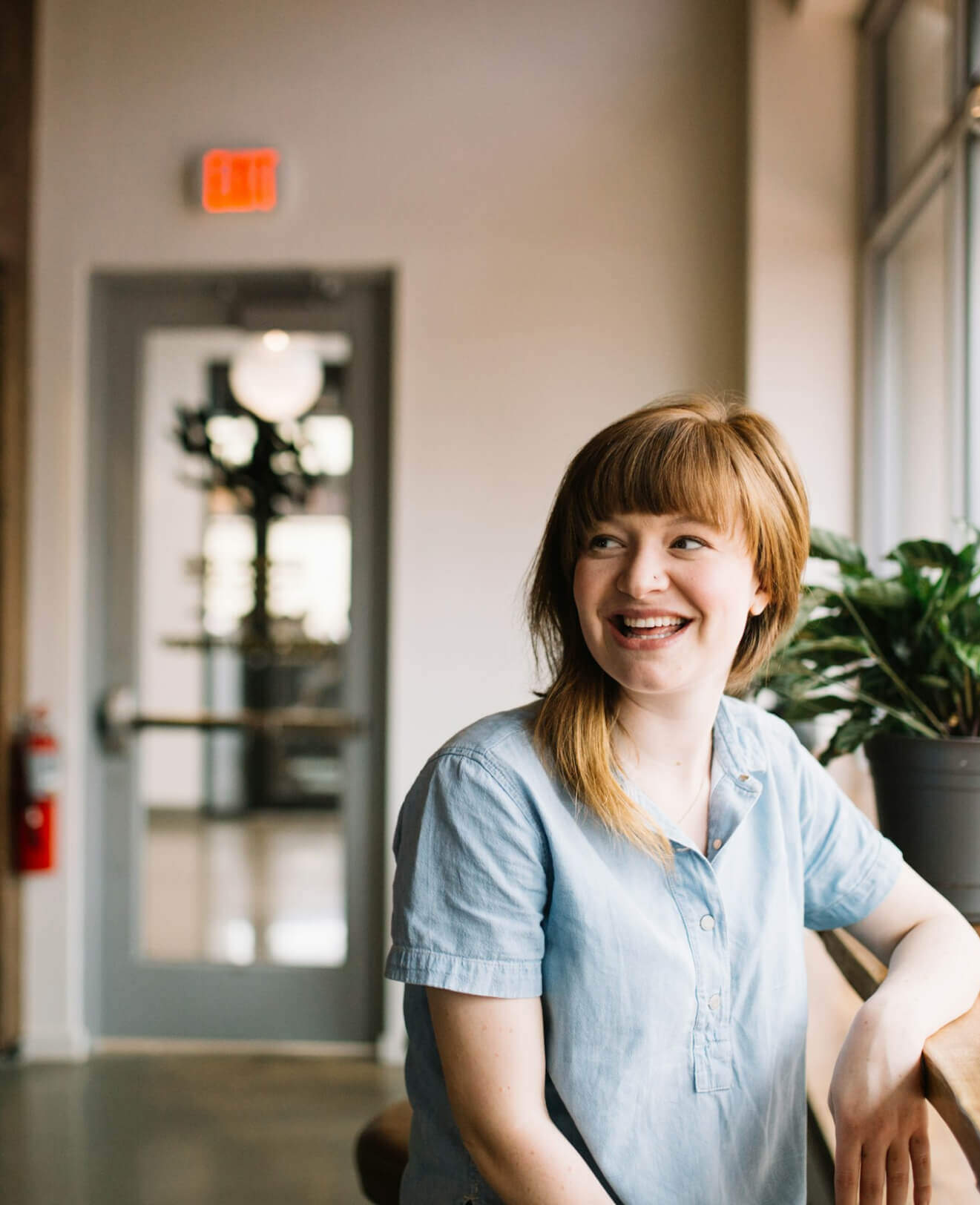 Person smiling at desk